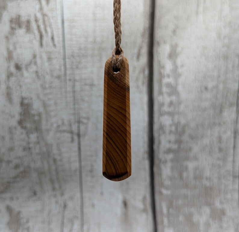 Yew wood roimata pendant.