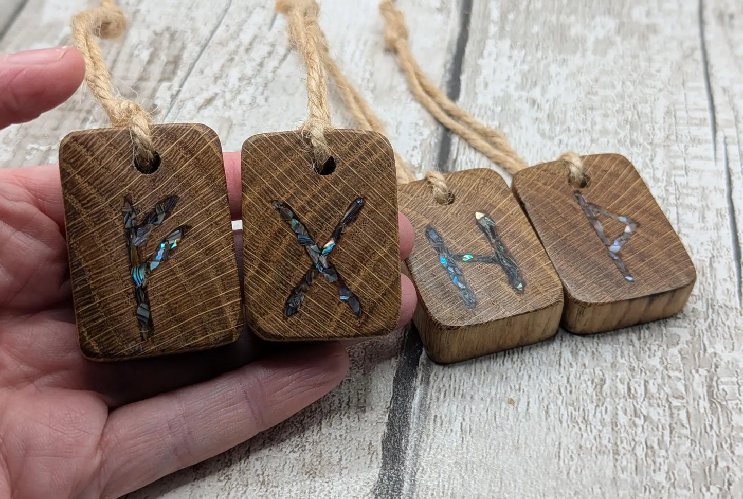 4 pack oak wood rune Christmas decoration with pāua shell.