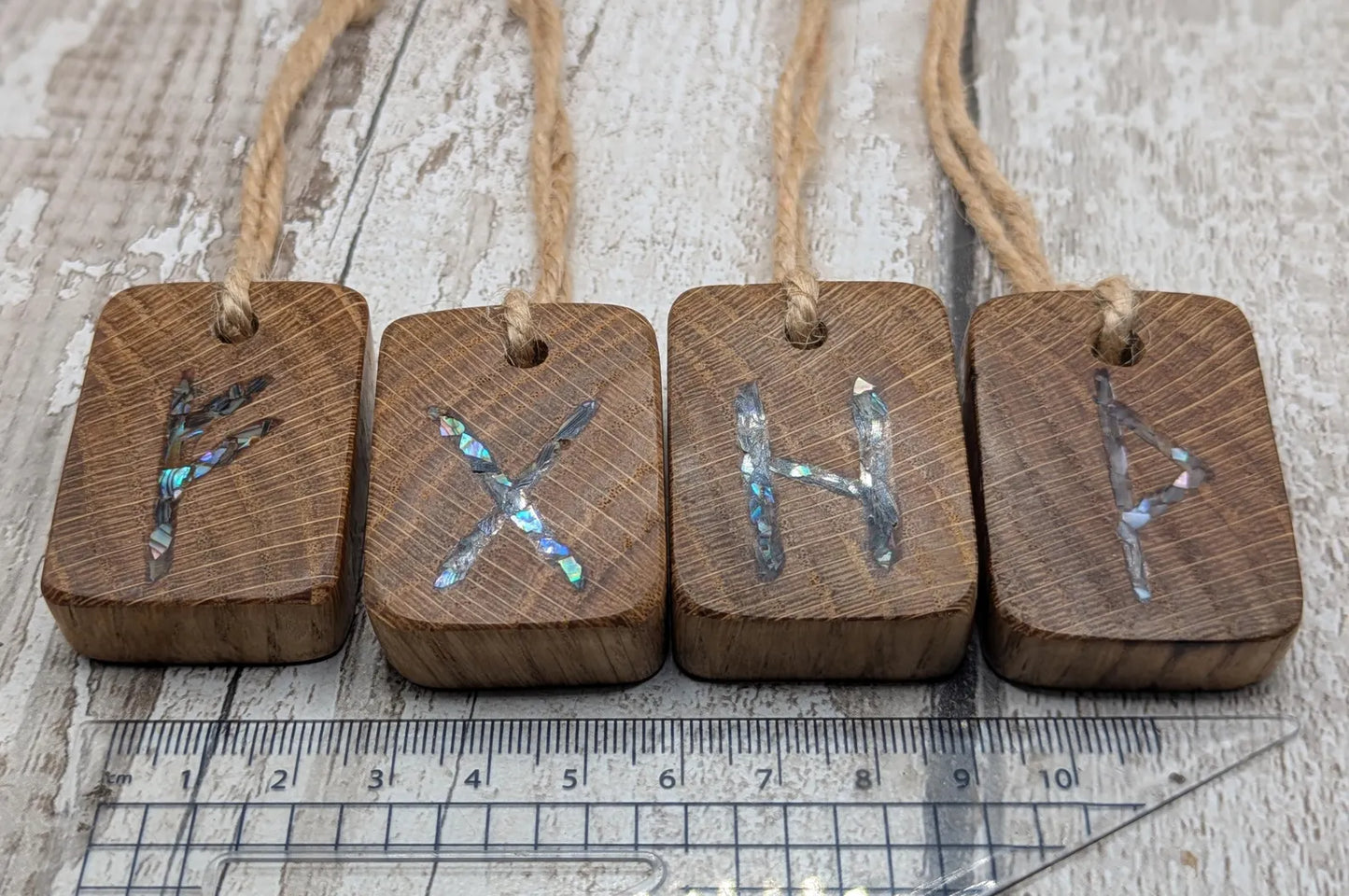 4 pack oak wood rune Christmas decoration with pāua shell.