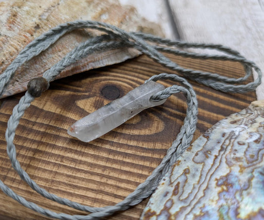 Quartz Crystal point pendant with inclusion.