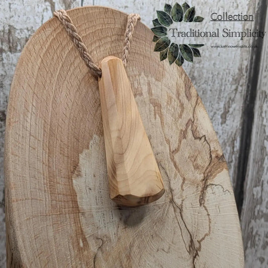 Yew wood roimata teardrop pendant.