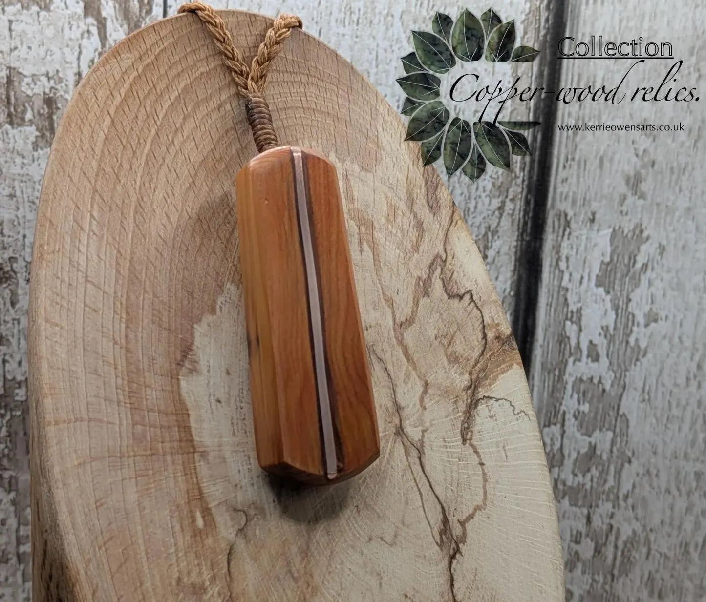 Yew wood roimata drop pendant with copper inlay.