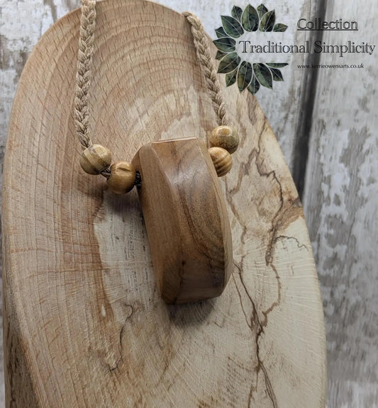 New Zealand Rimu wood unisex pendant.