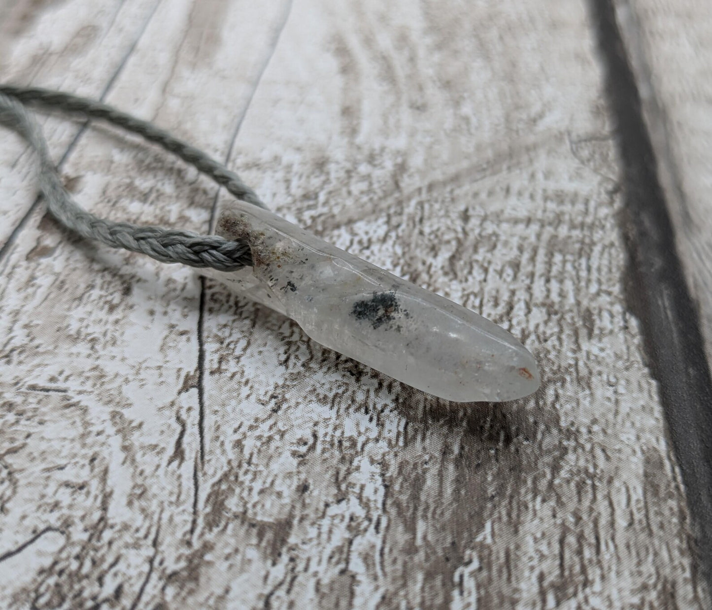 Quartz Crystal point pendant with inclusion.