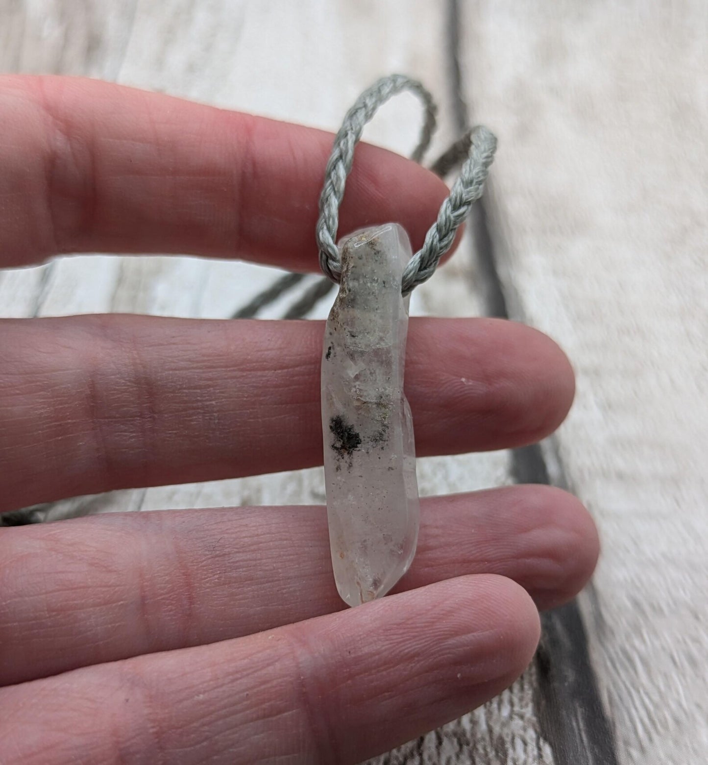 Quartz Crystal point pendant with inclusion.