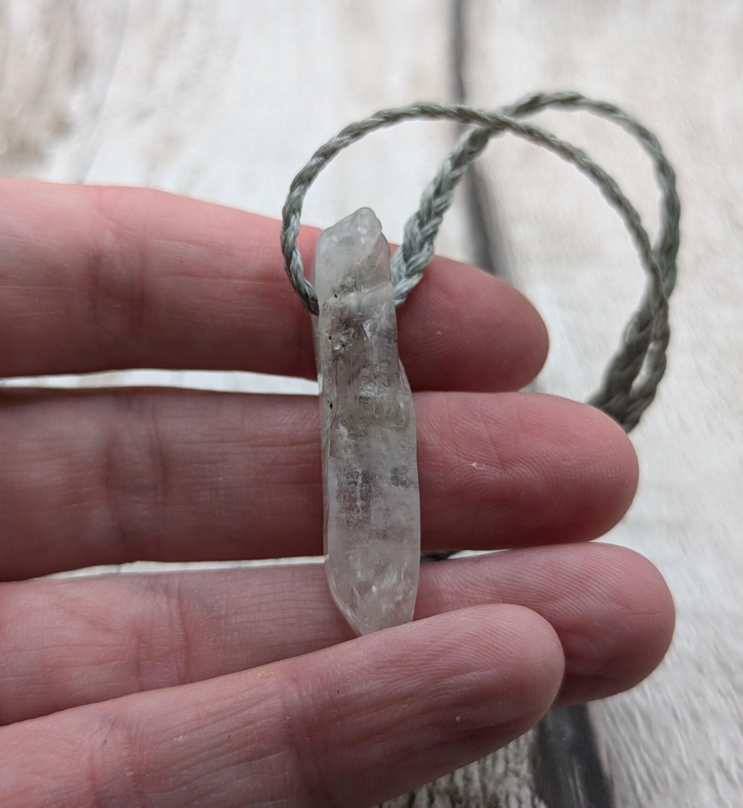 Quartz Crystal point pendant with inclusion.