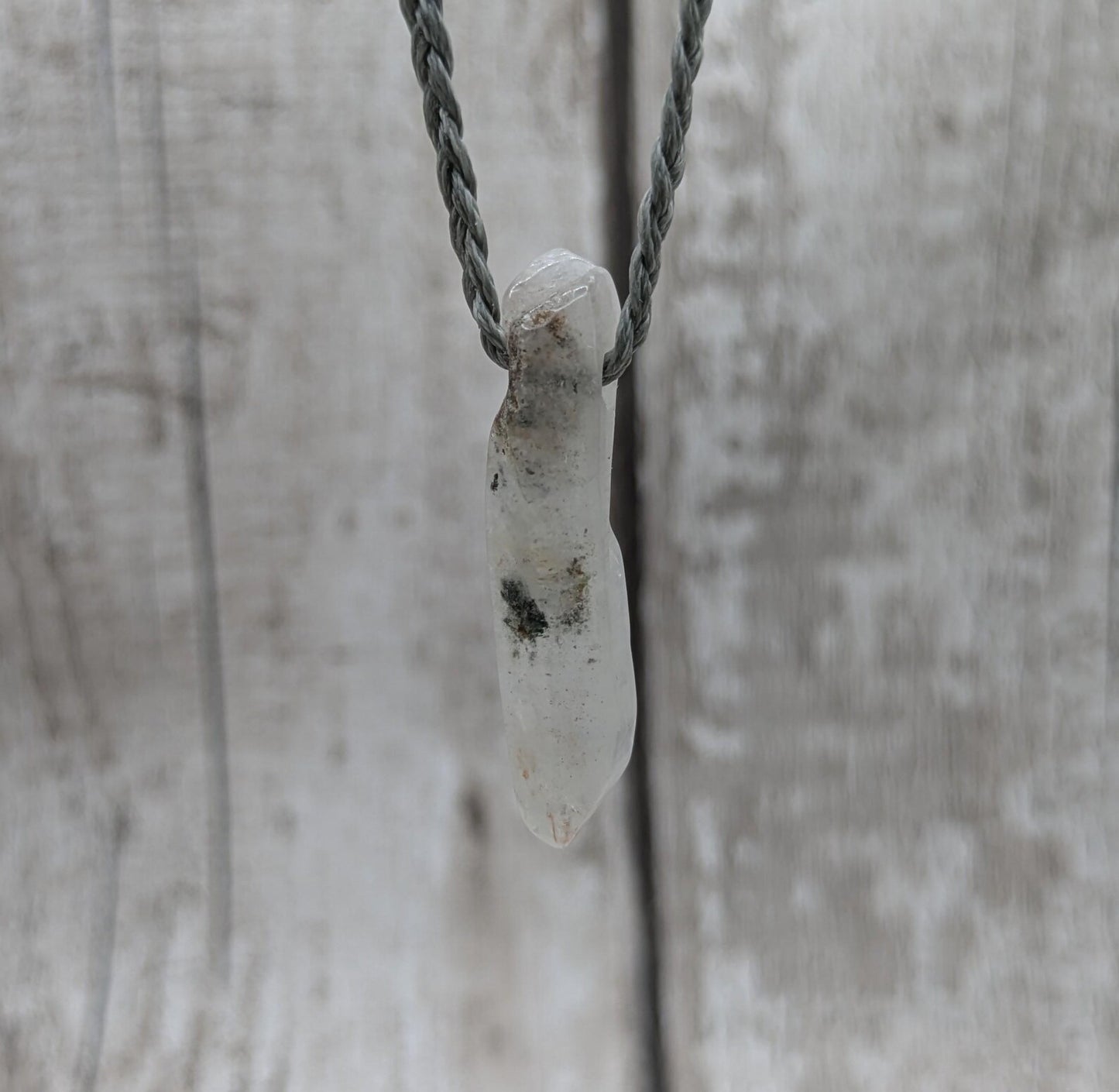 Quartz Crystal point pendant with inclusion.