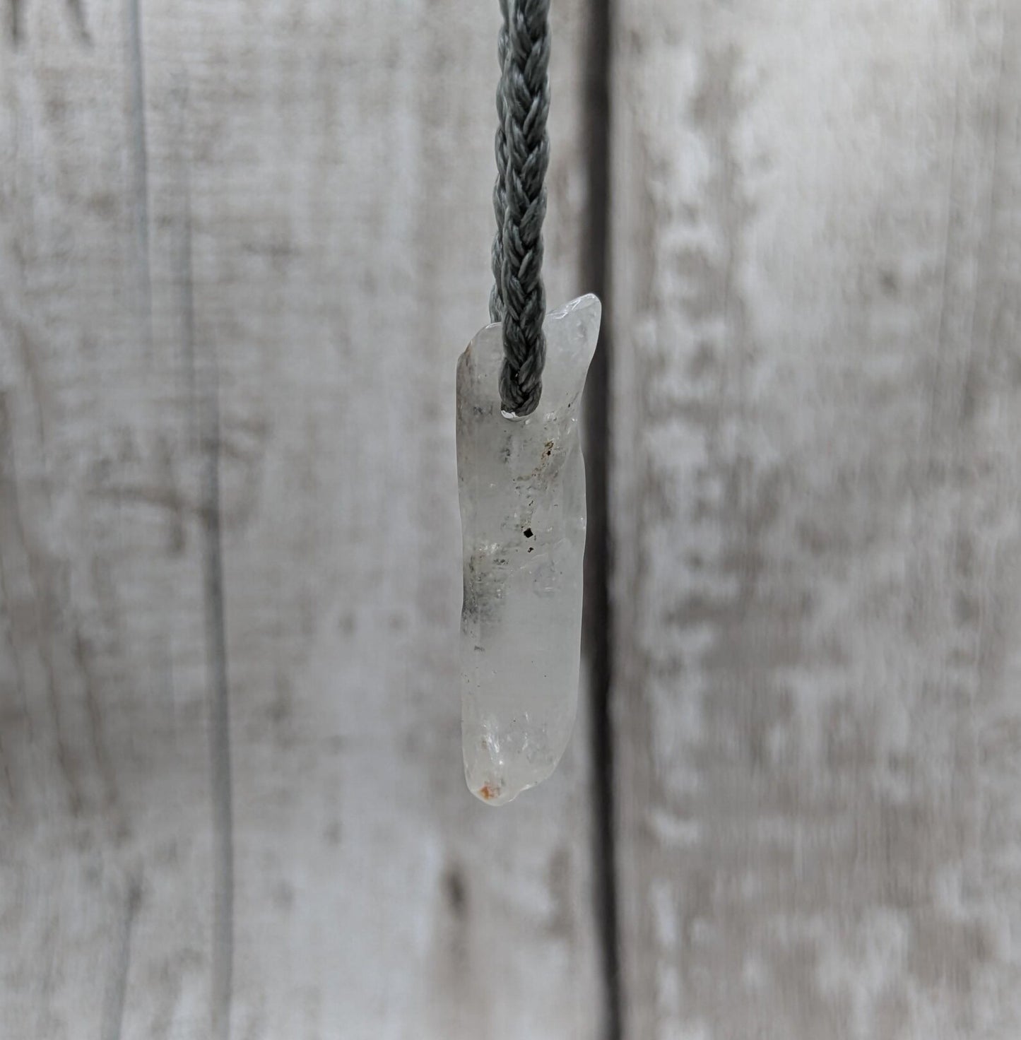 Quartz Crystal point pendant with inclusion.