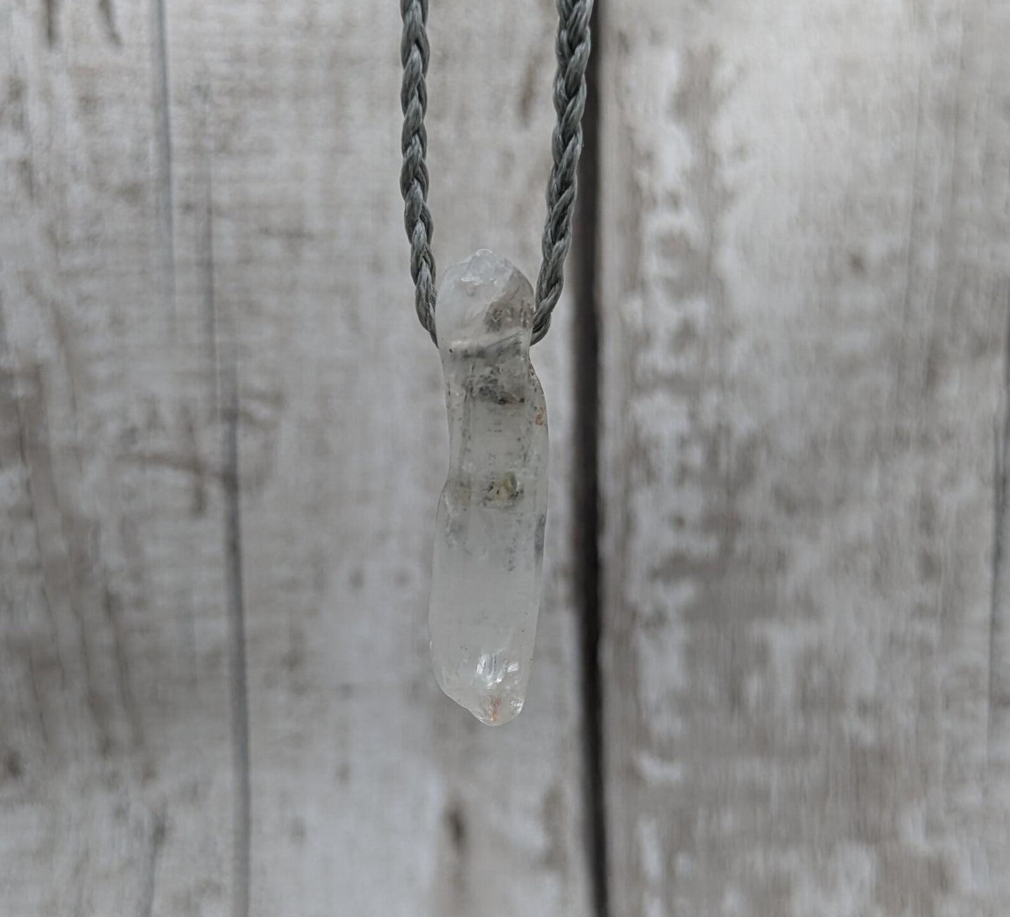 Quartz Crystal point pendant with inclusion.