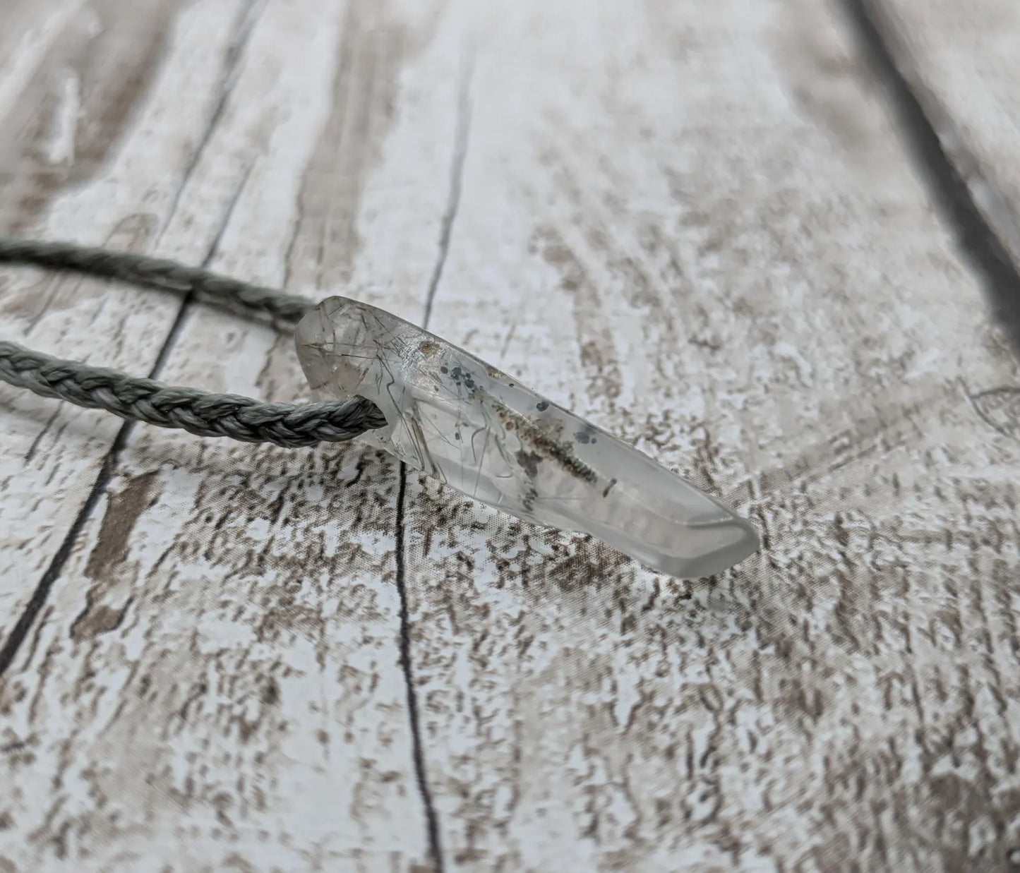 Rutilated quartz Crystal point pendant.