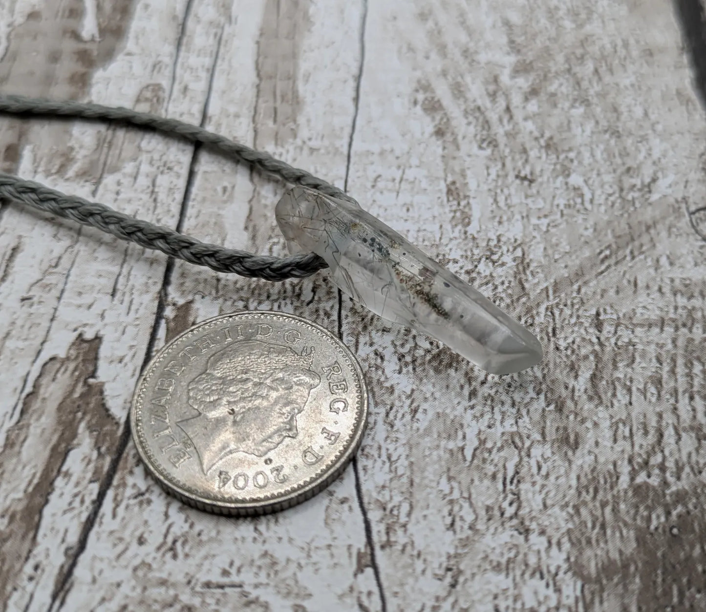 Rutilated quartz Crystal point pendant.