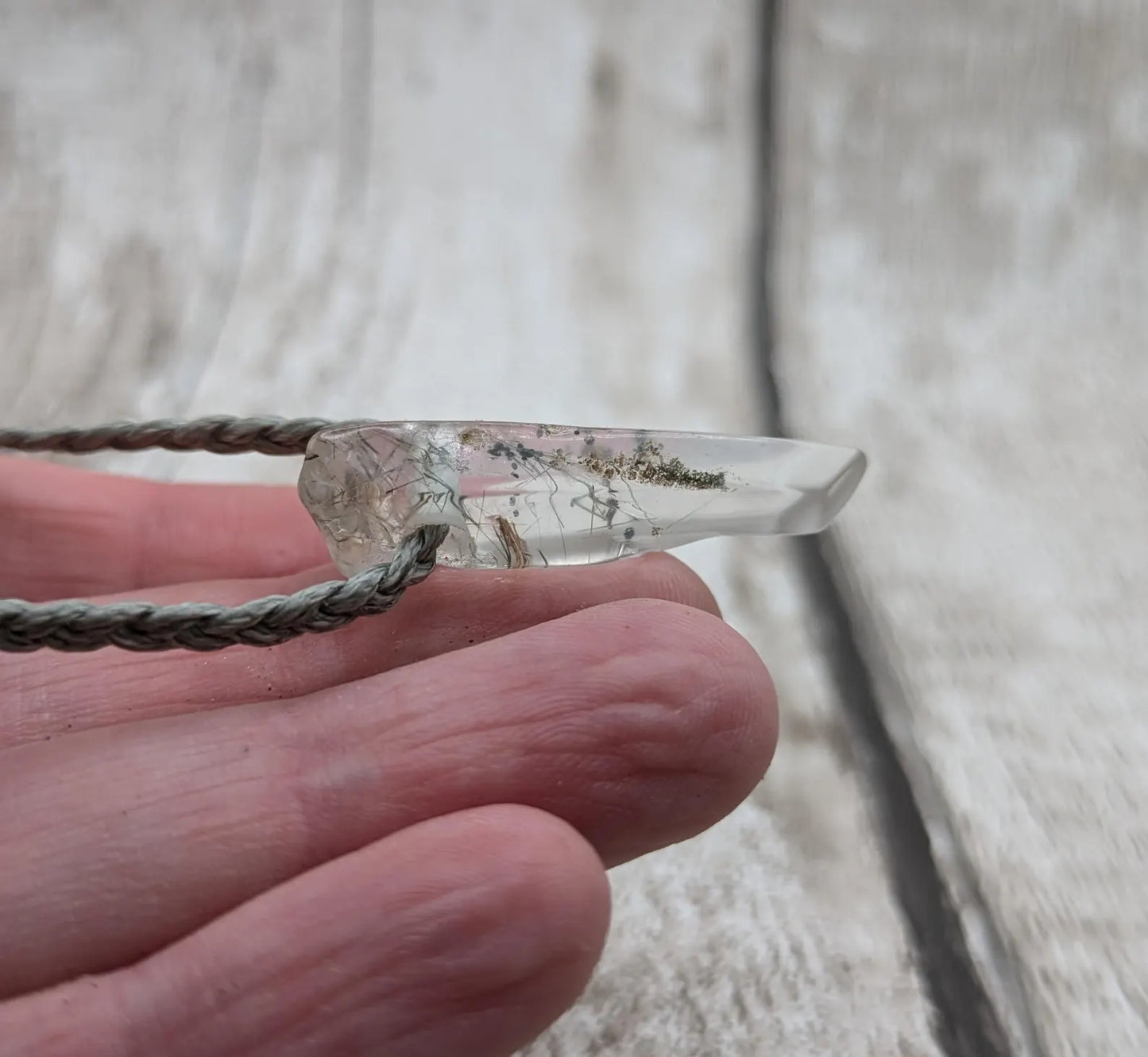 Rutilated quartz Crystal point pendant.