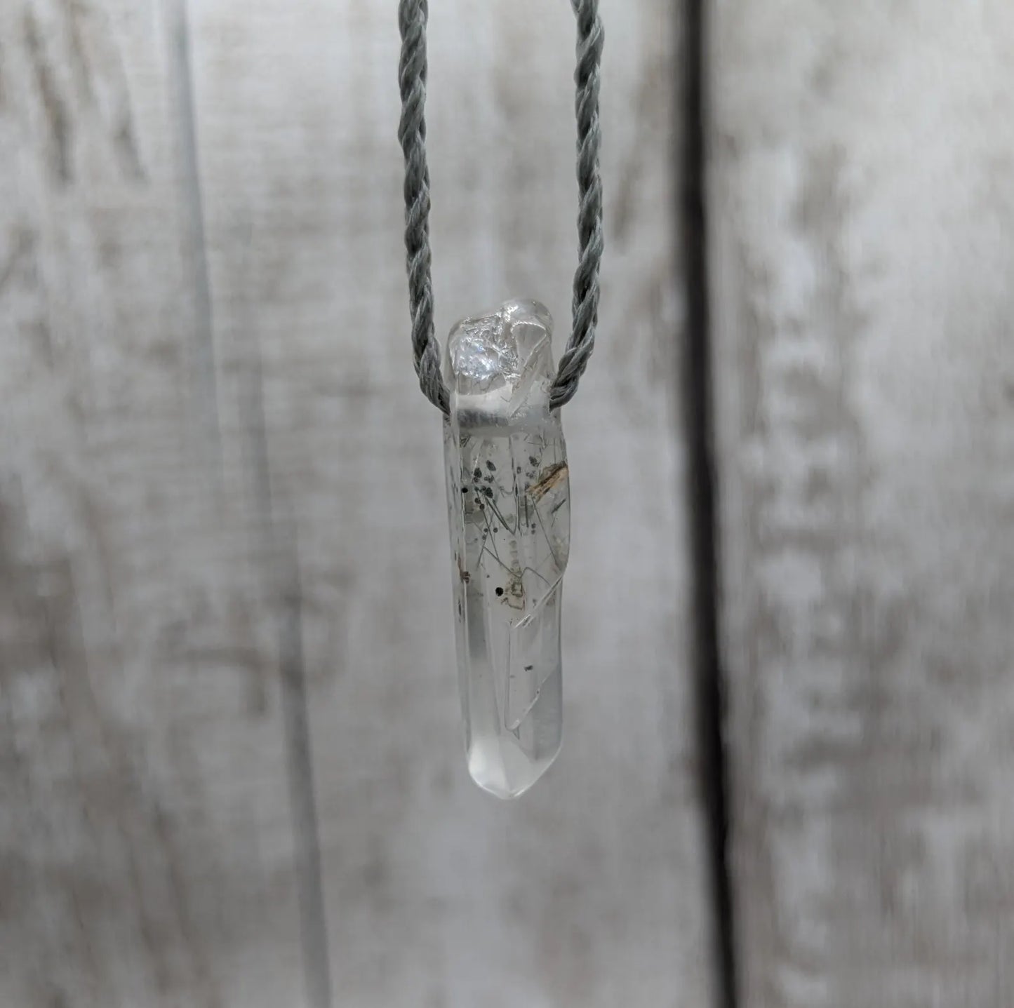 Rutilated quartz Crystal point pendant.