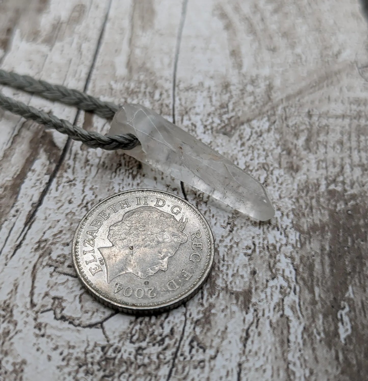 Clear quartz Crystal point pendant.