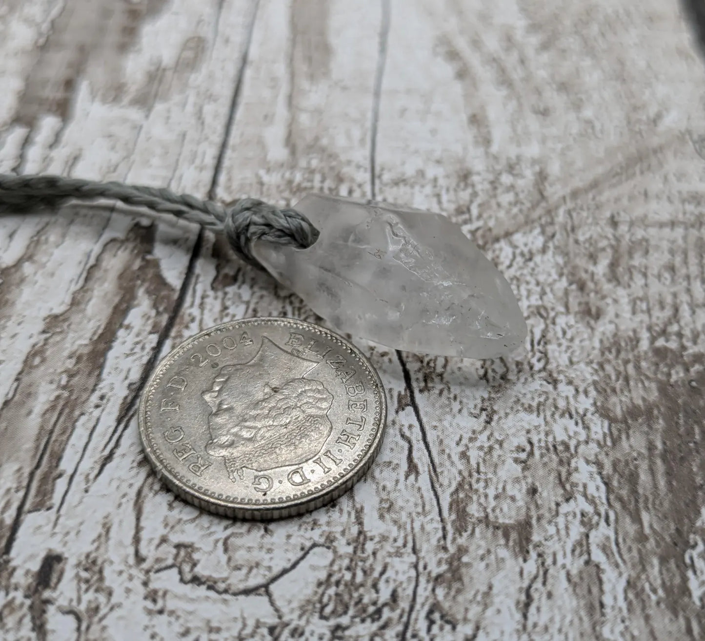 Clear quartz Crystal point pendant.