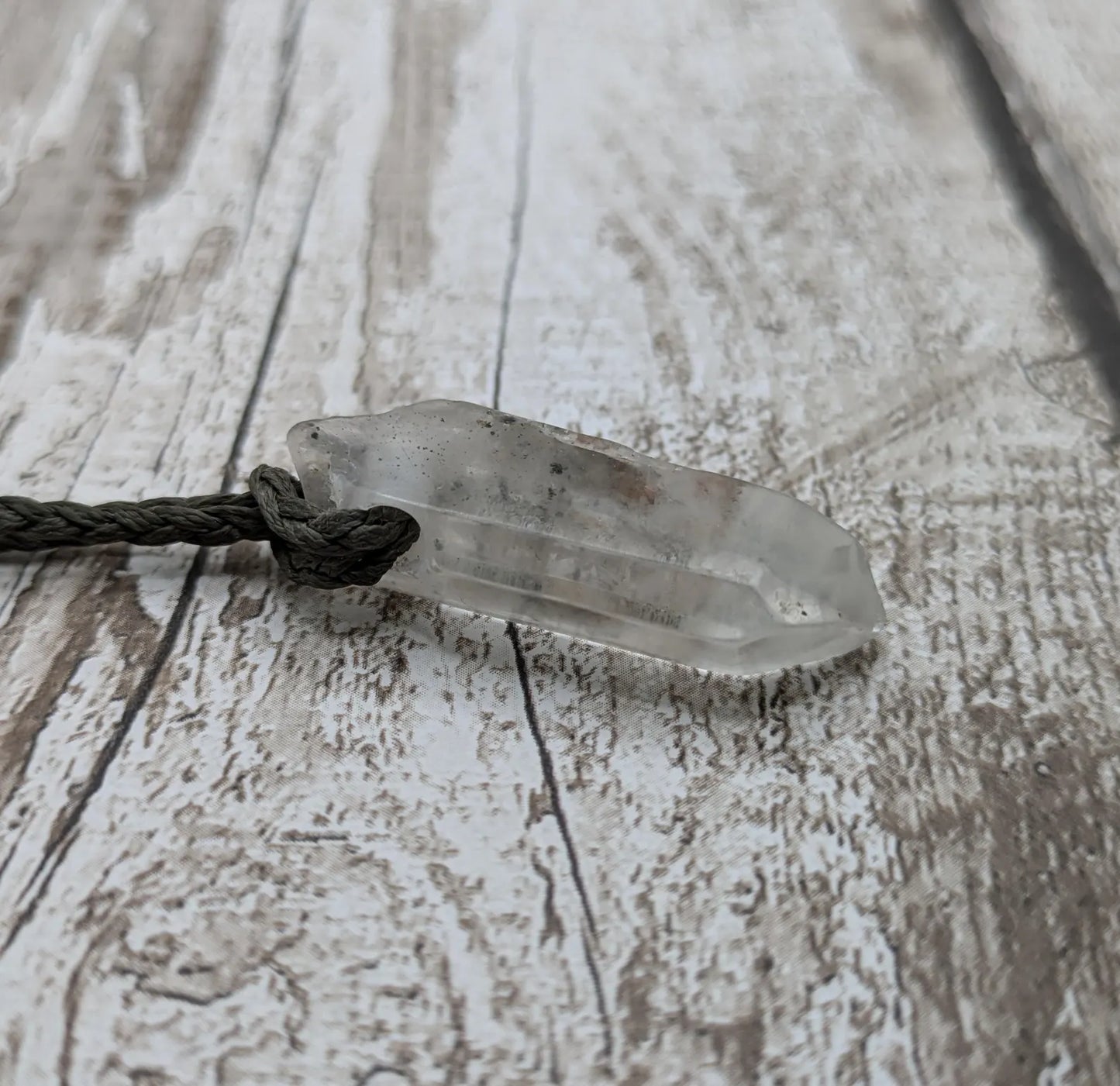 Clear quartz Crystal point pendant.