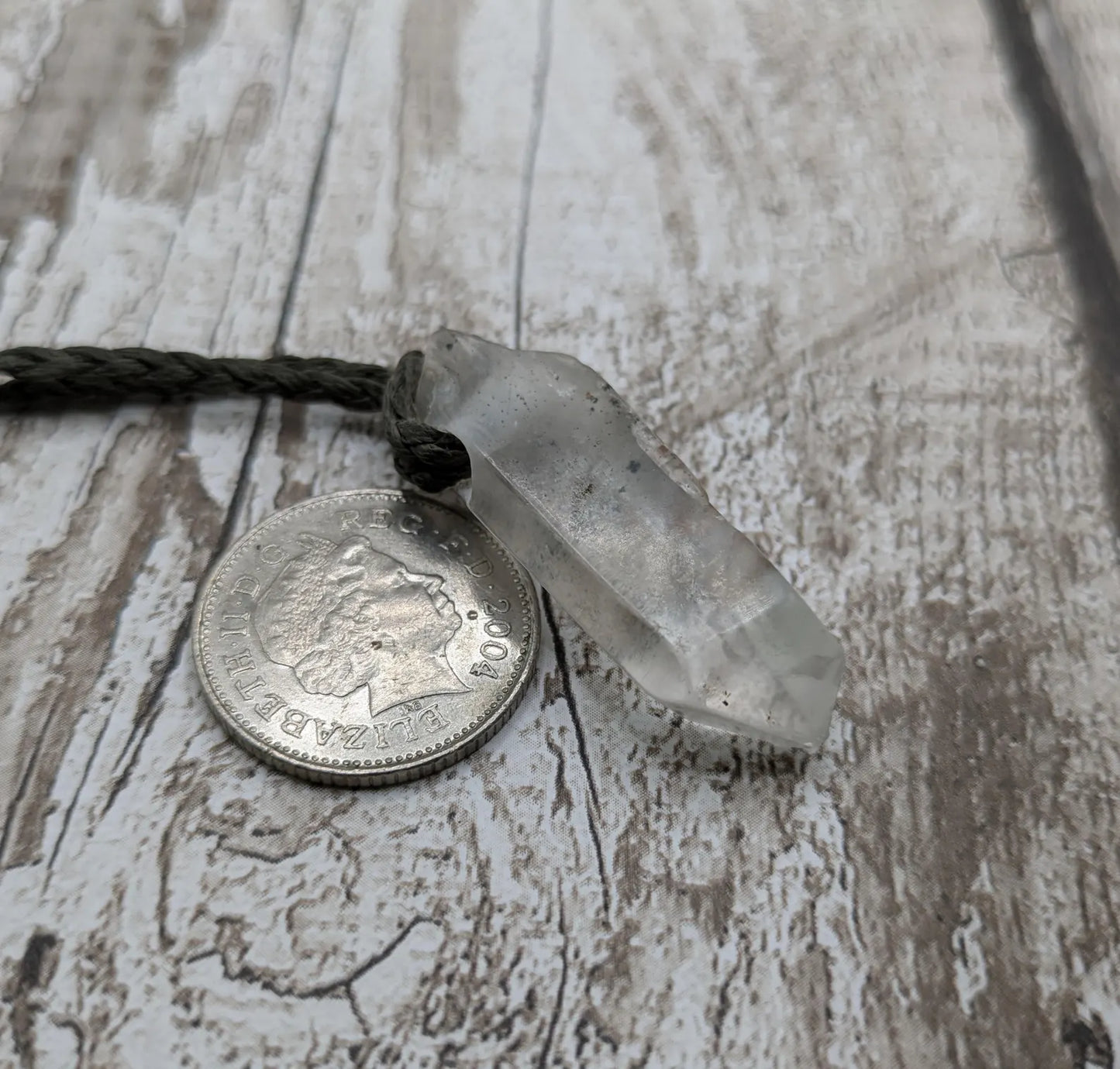 Clear quartz Crystal point pendant.