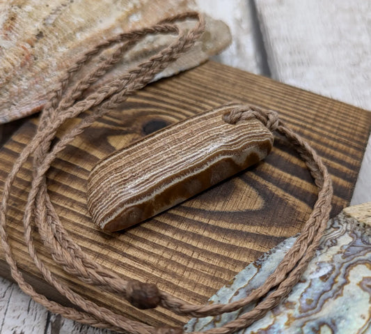 Striped argonite Toki styled pendant.