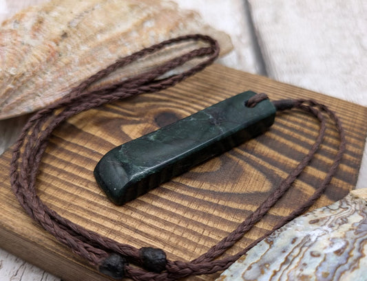 New Zealand serpentine Pounamu with Pāua shell inlay.