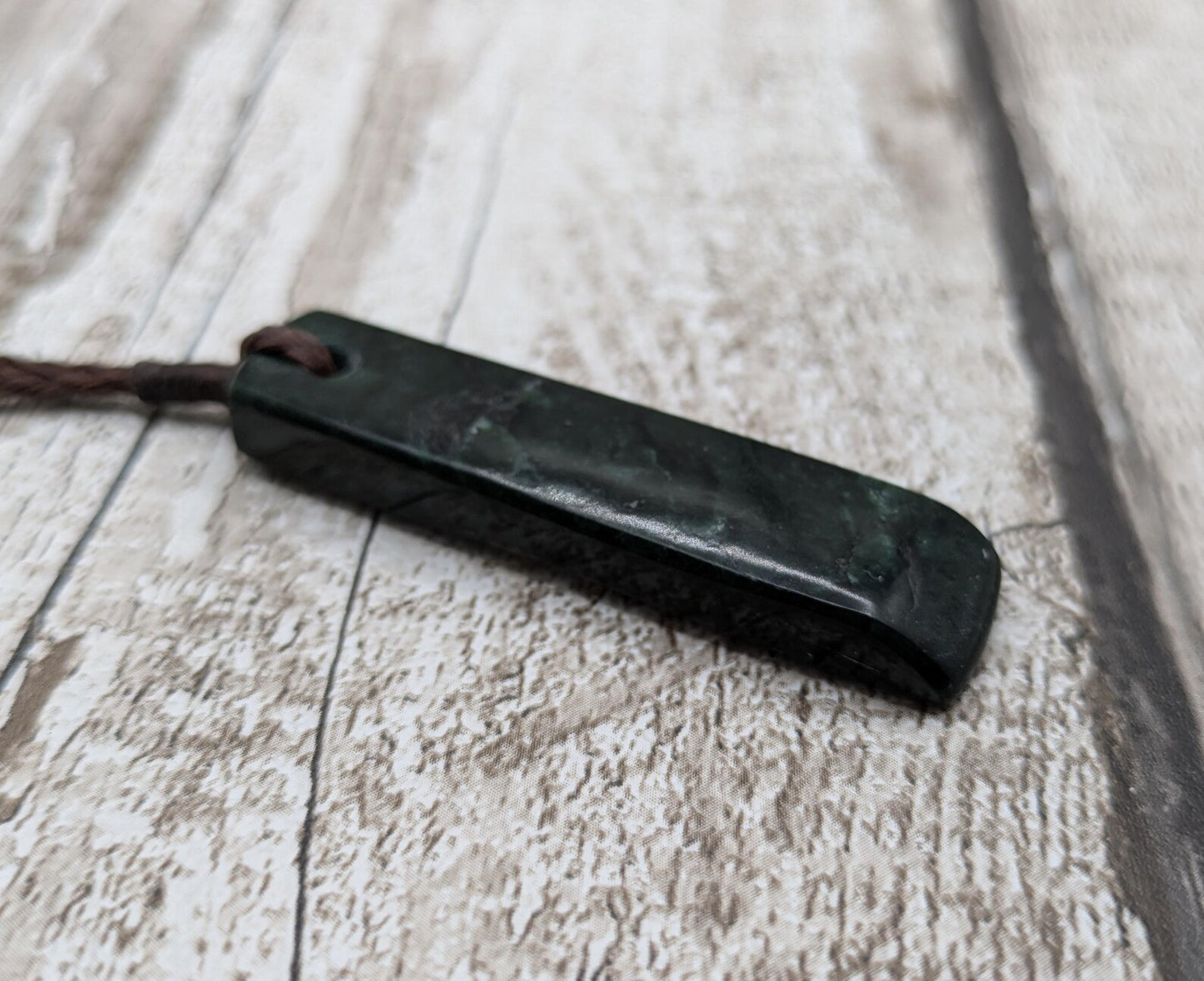 New Zealand serpentine Pounamu with Pāua shell inlay.