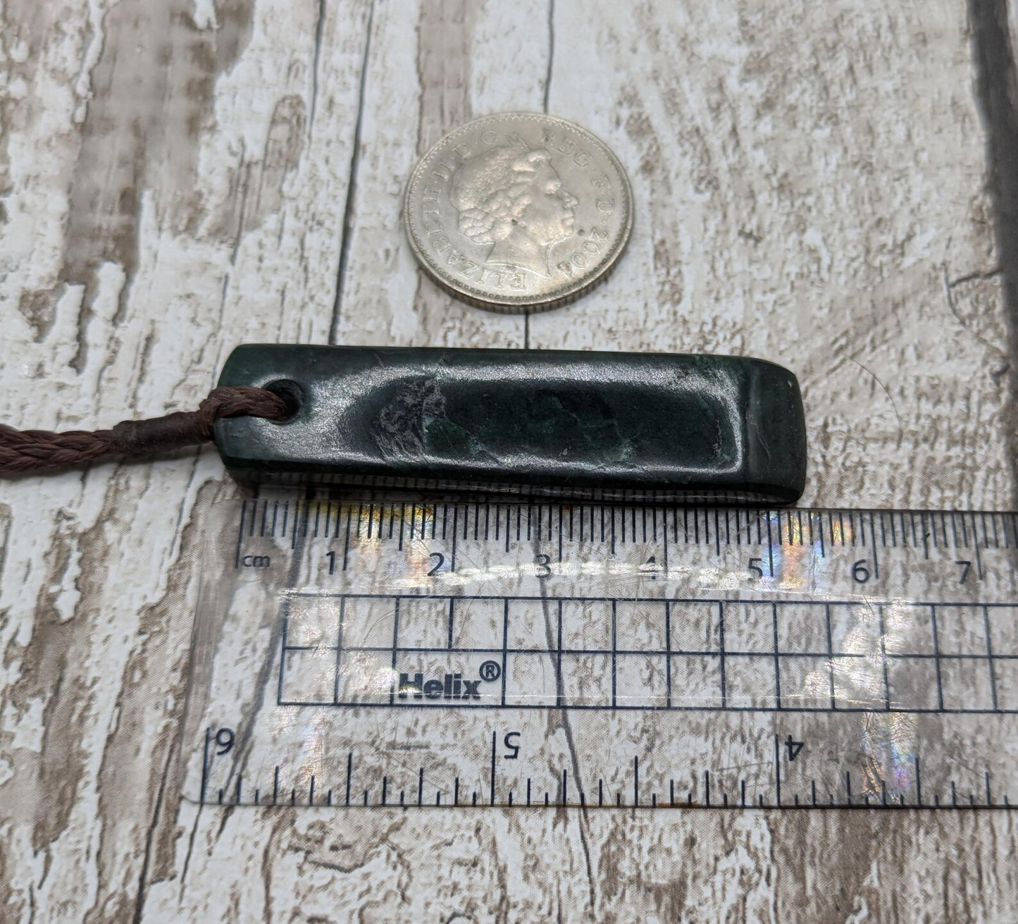 New Zealand serpentine Pounamu with Pāua shell inlay.