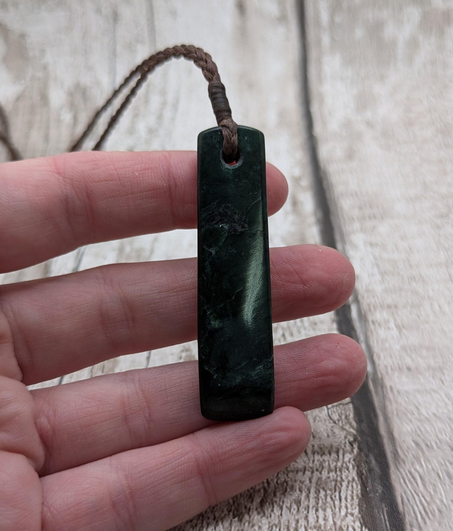 New Zealand serpentine Pounamu with Pāua shell inlay.