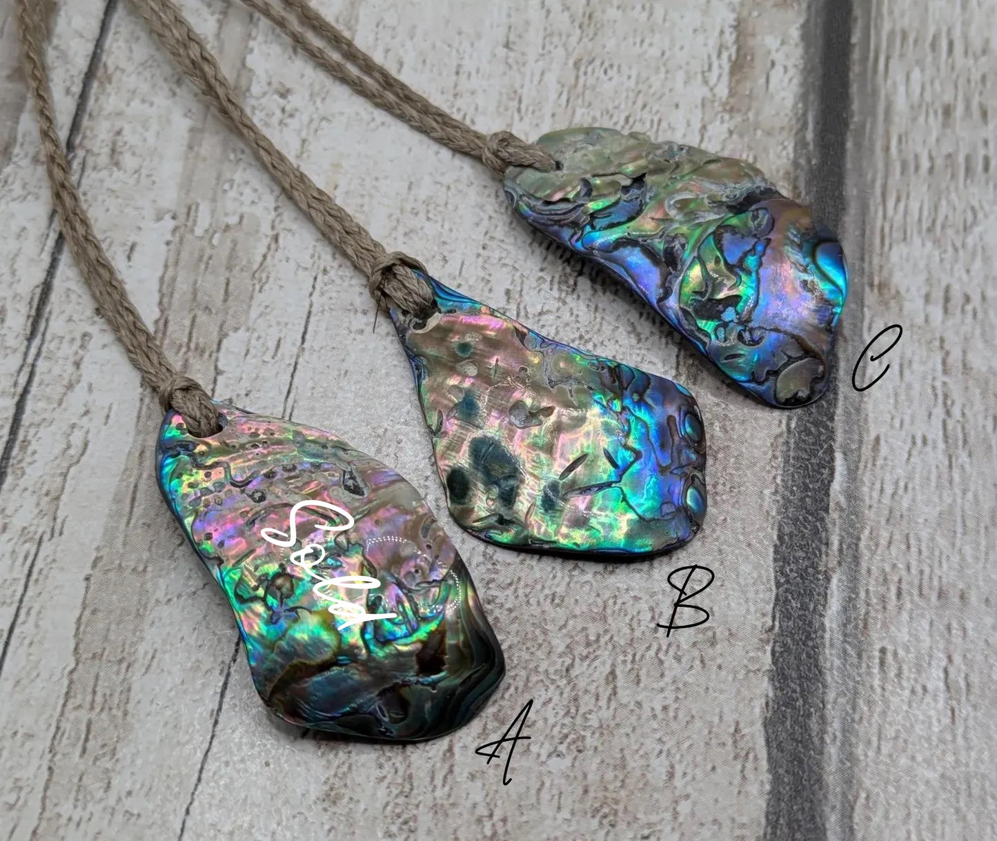 New Zealand free form wild tumbled rainbow Pāua pendant.