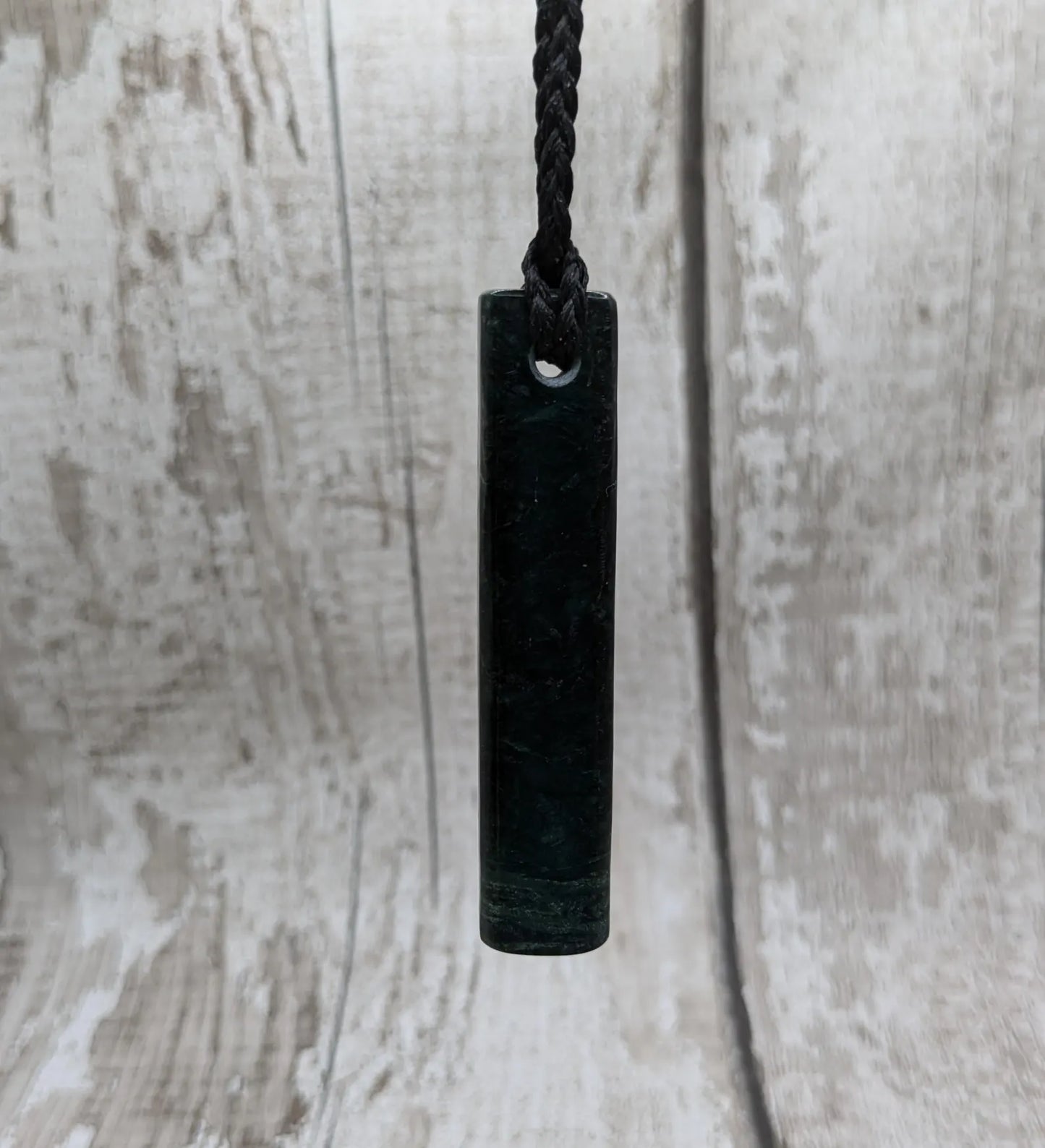 New Zealand serpentine Toki style Pounamu pendant.