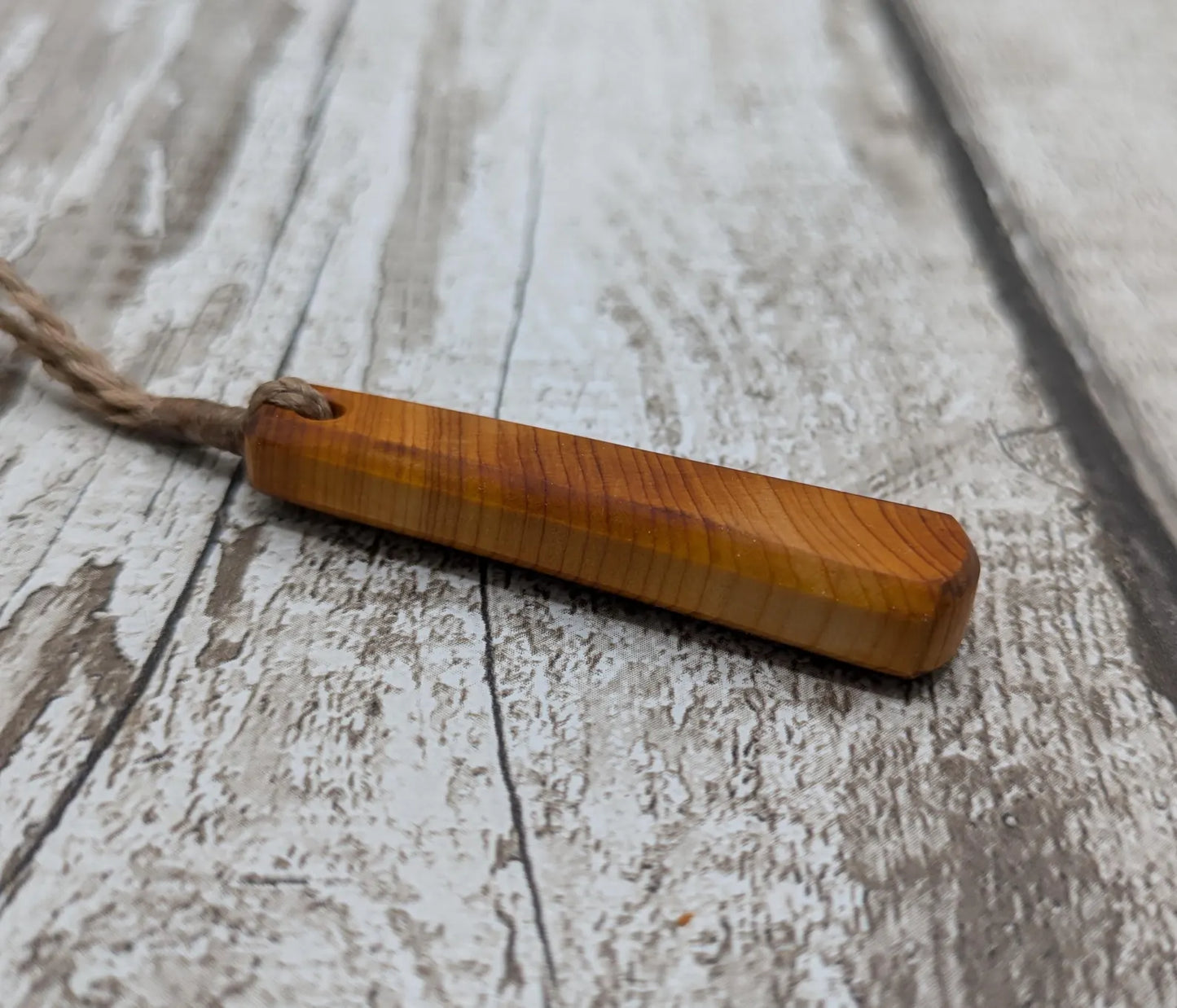 Yew wood roimata teardrop pendant.