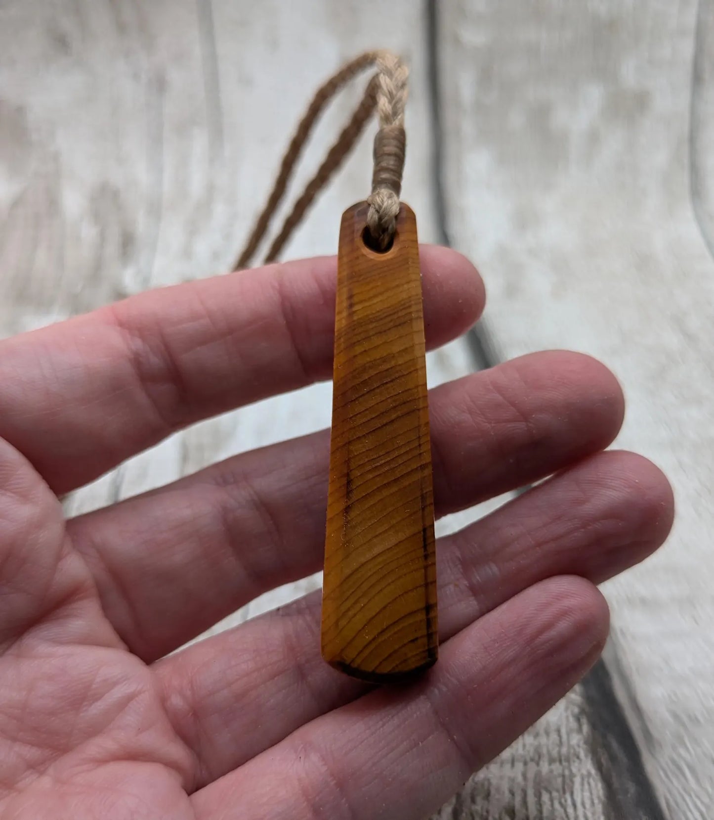 Yew wood roimata teardrop pendant.