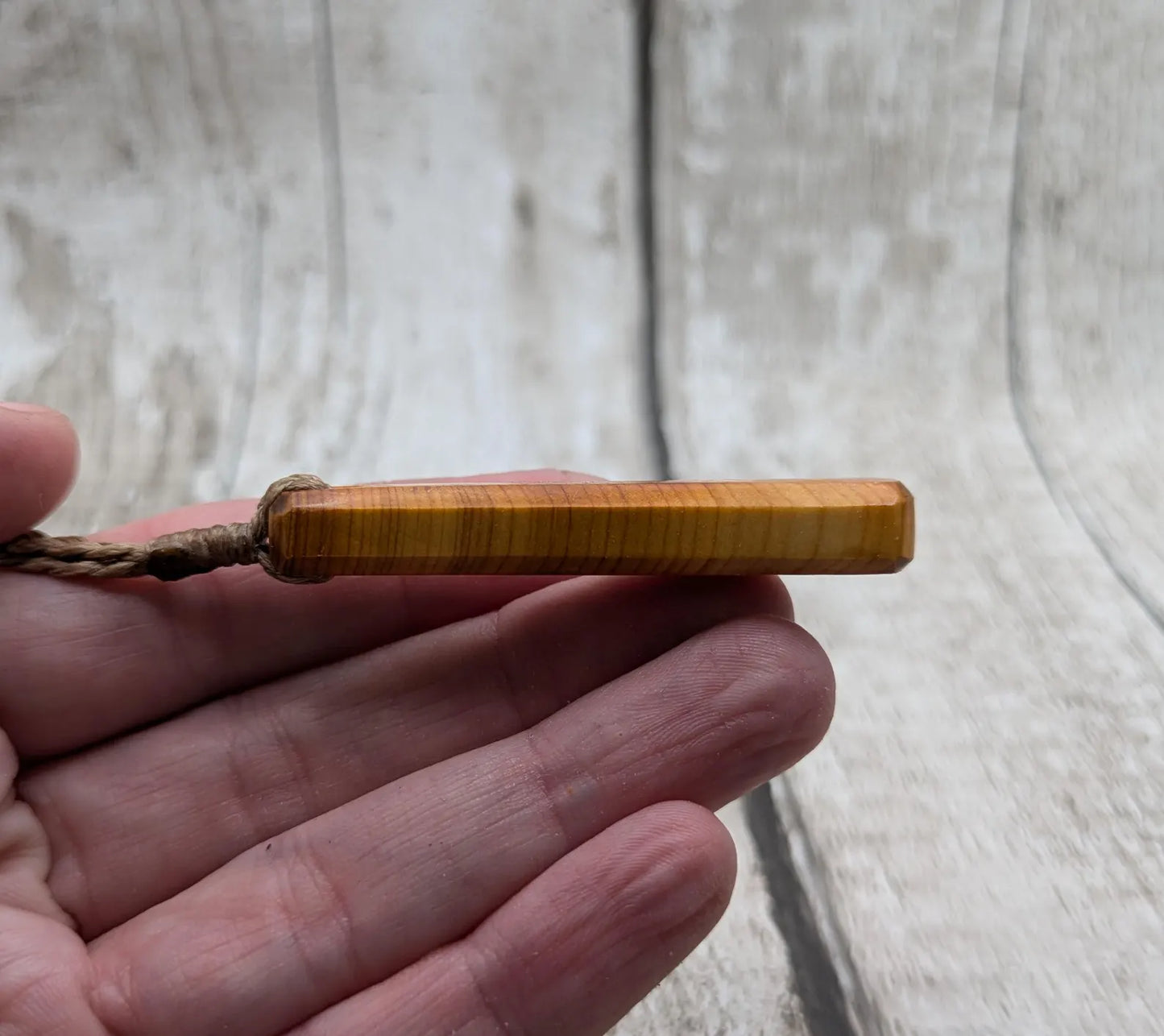 Yew wood roimata teardrop pendant.