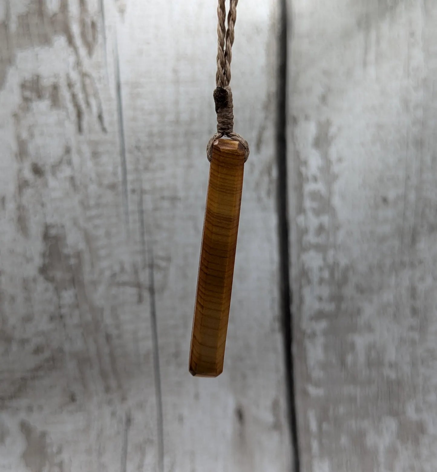 Yew wood roimata teardrop pendant.