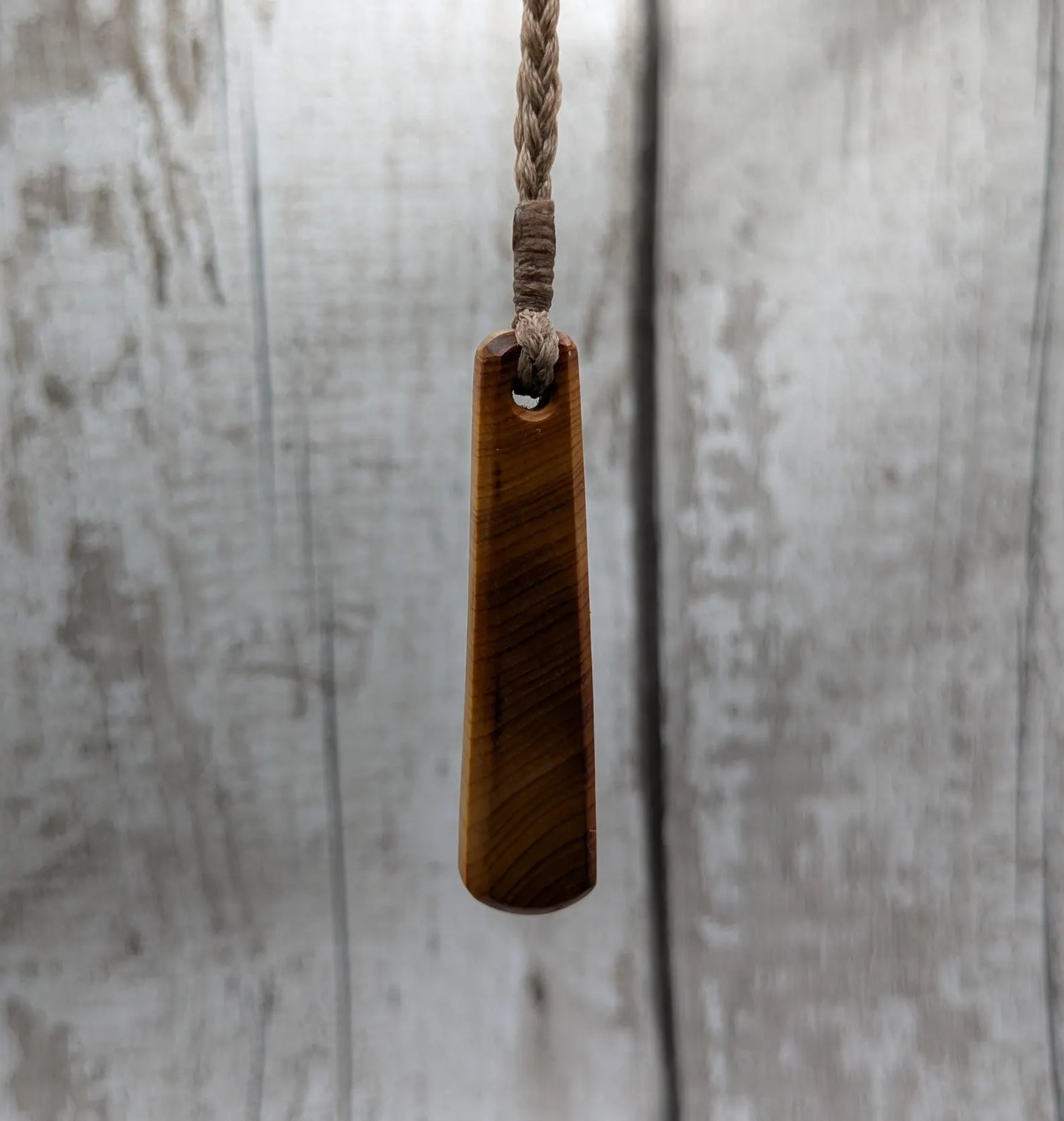 Yew wood roimata teardrop pendant.