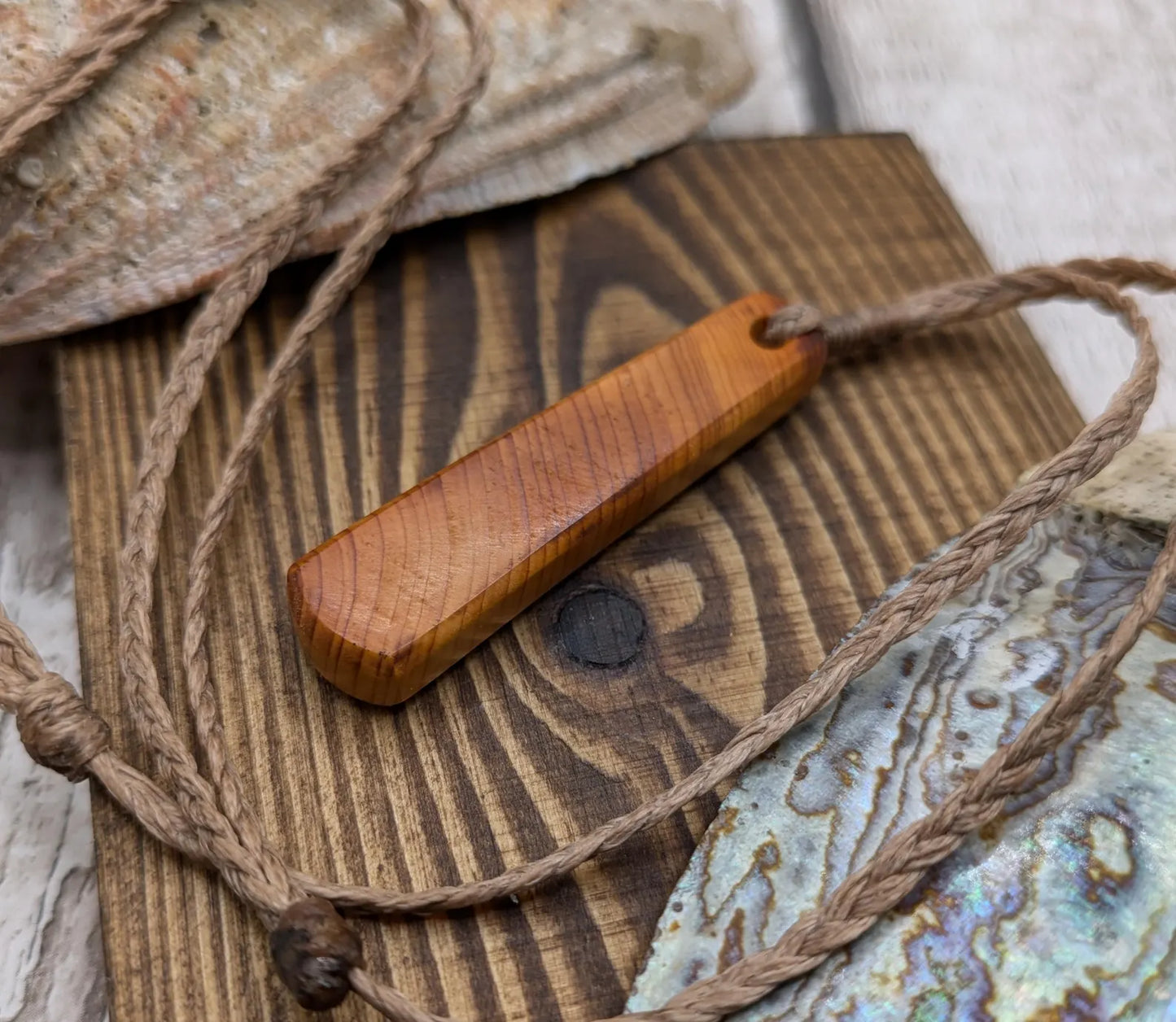 Yew wood roimata teardrop pendant.