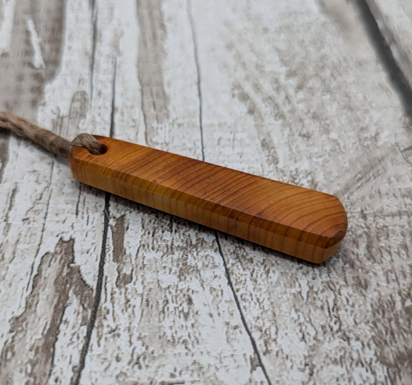 Yew wood roimata teardrop pendant.