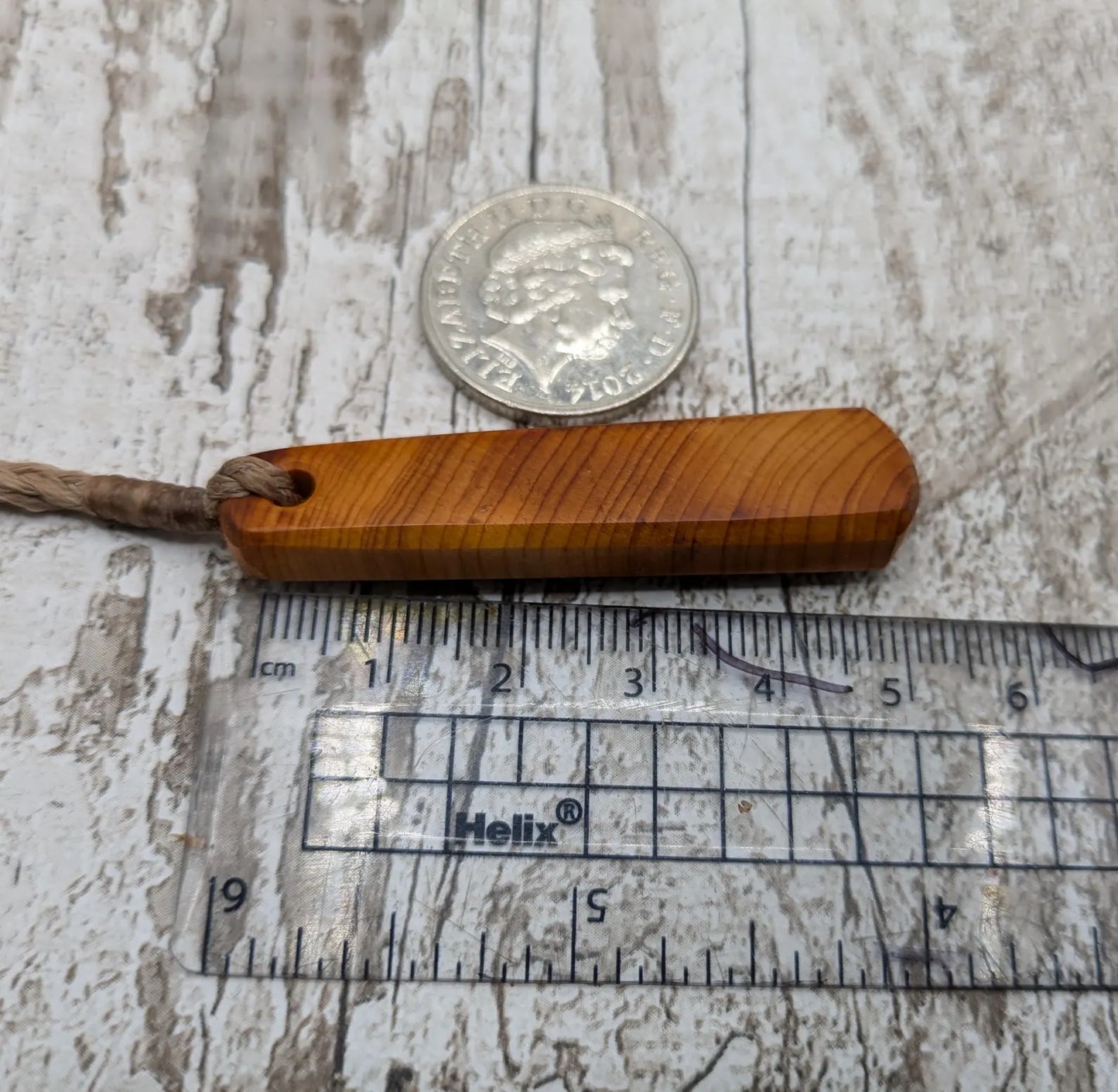 Yew wood roimata teardrop pendant.