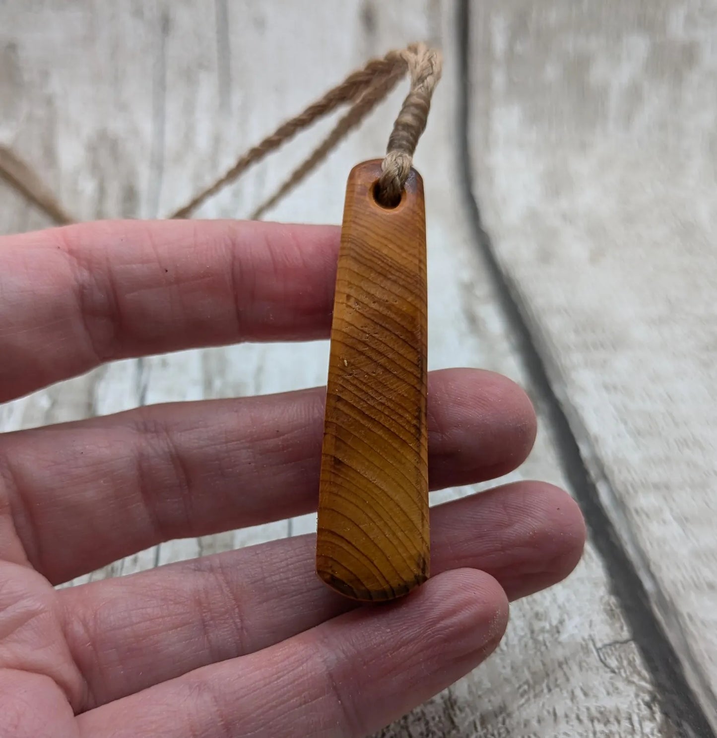 Yew wood roimata teardrop pendant.