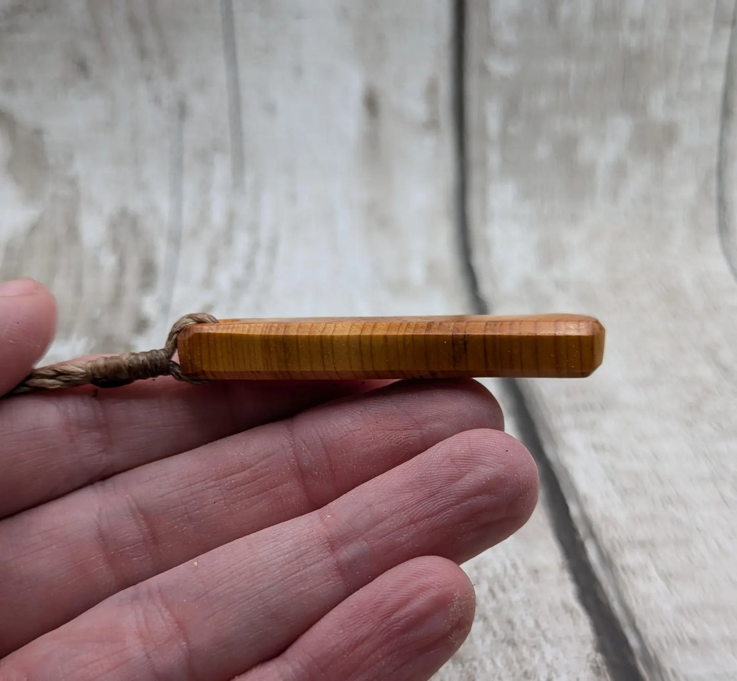 Yew wood roimata teardrop pendant.