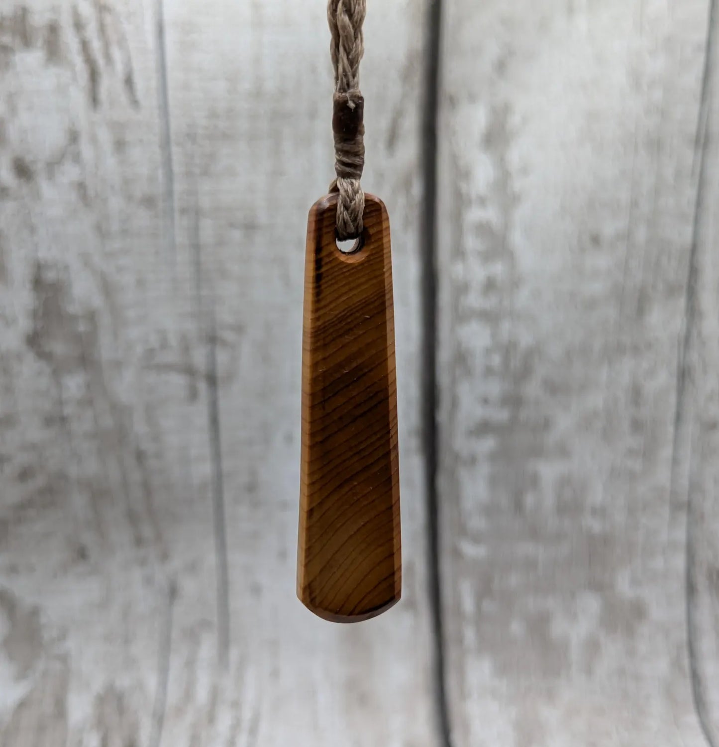 Yew wood roimata teardrop pendant.