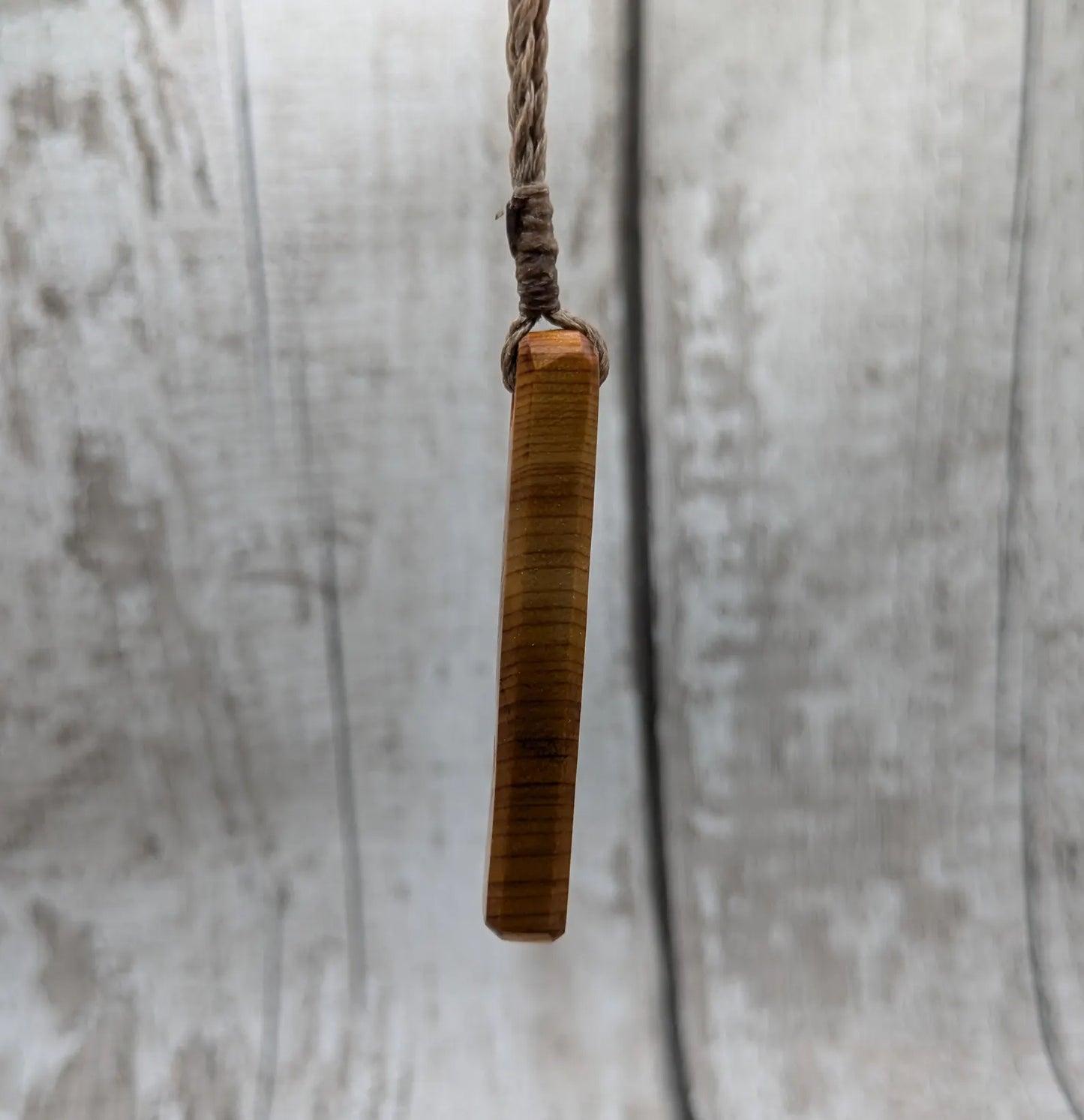 Yew wood roimata teardrop pendant.