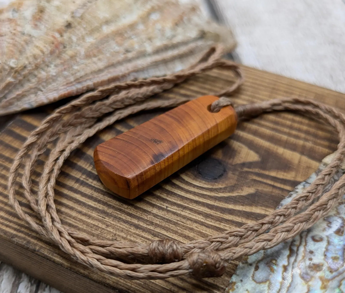 Yew wood roimata tear drop pendant.