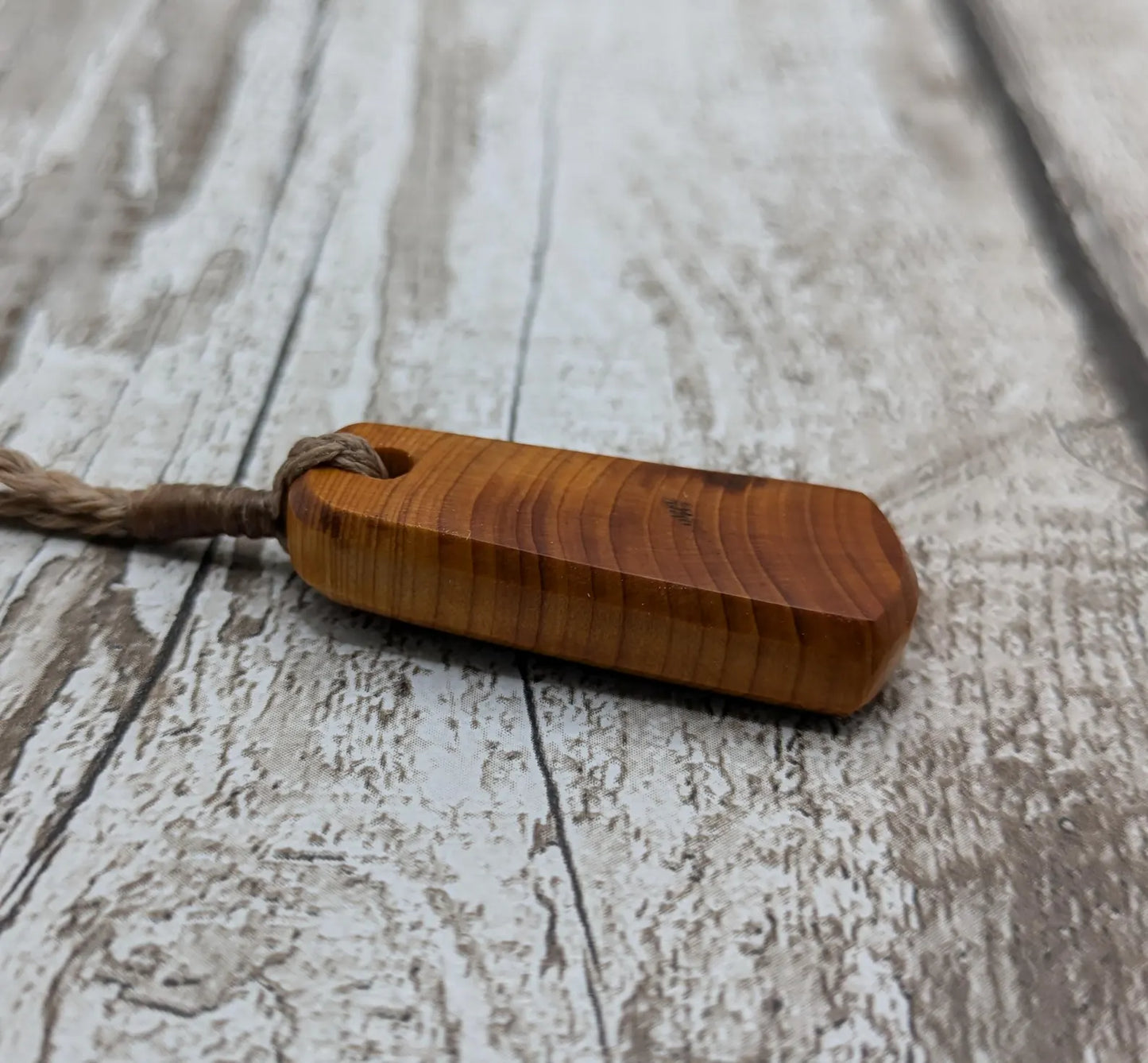 Yew wood roimata tear drop pendant.