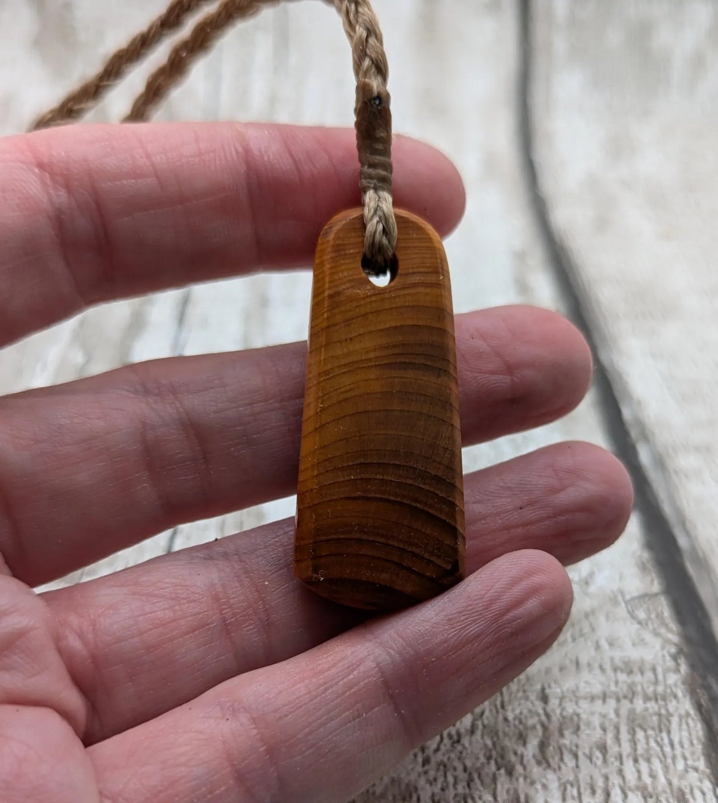 Yew wood roimata tear drop pendant.