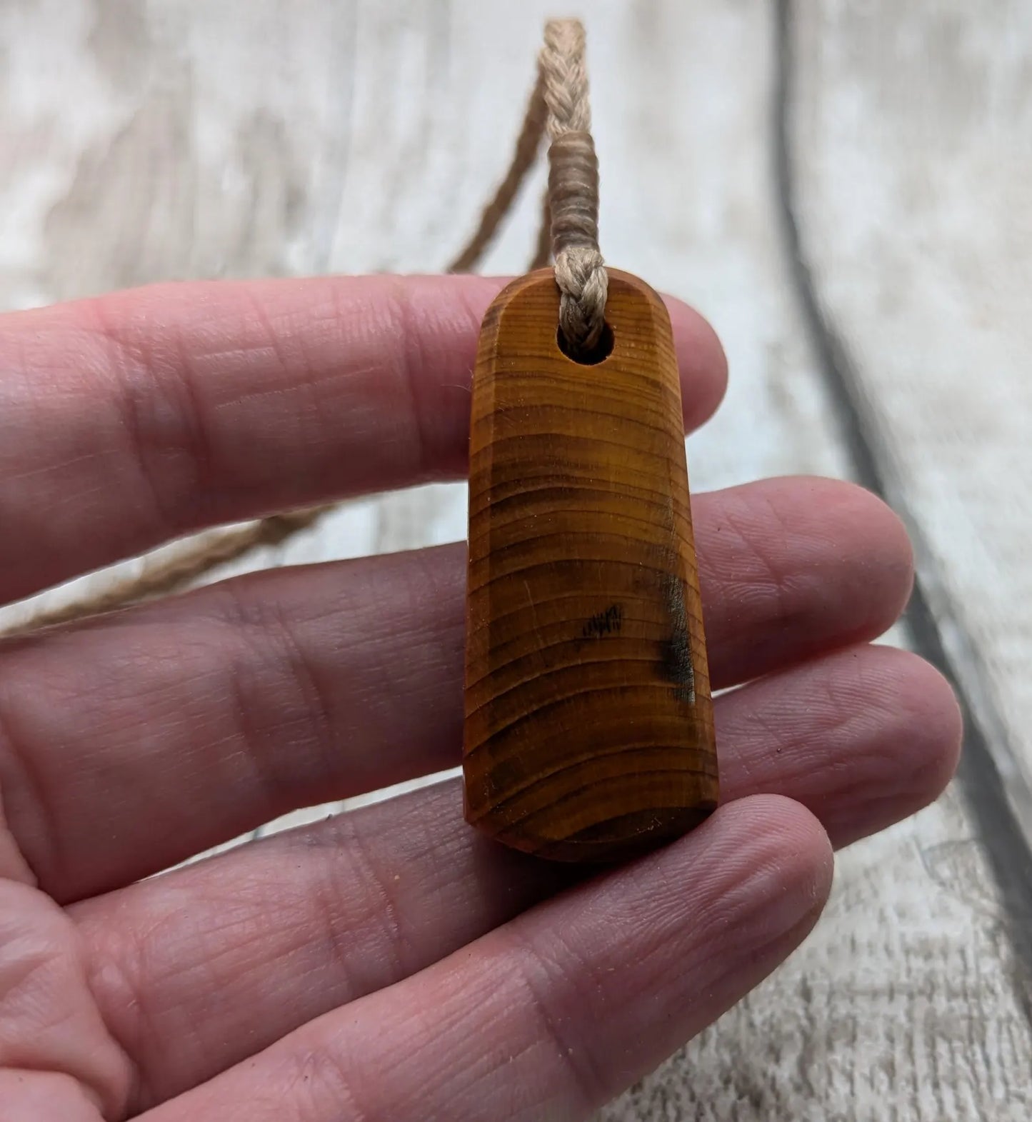 Yew wood roimata tear drop pendant.