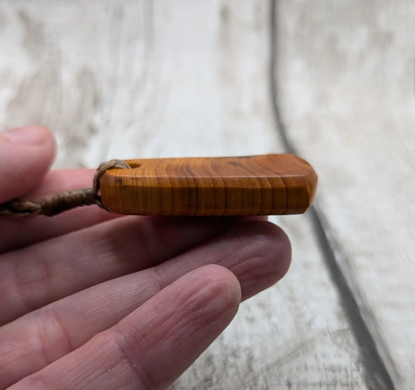 Yew wood roimata tear drop pendant.