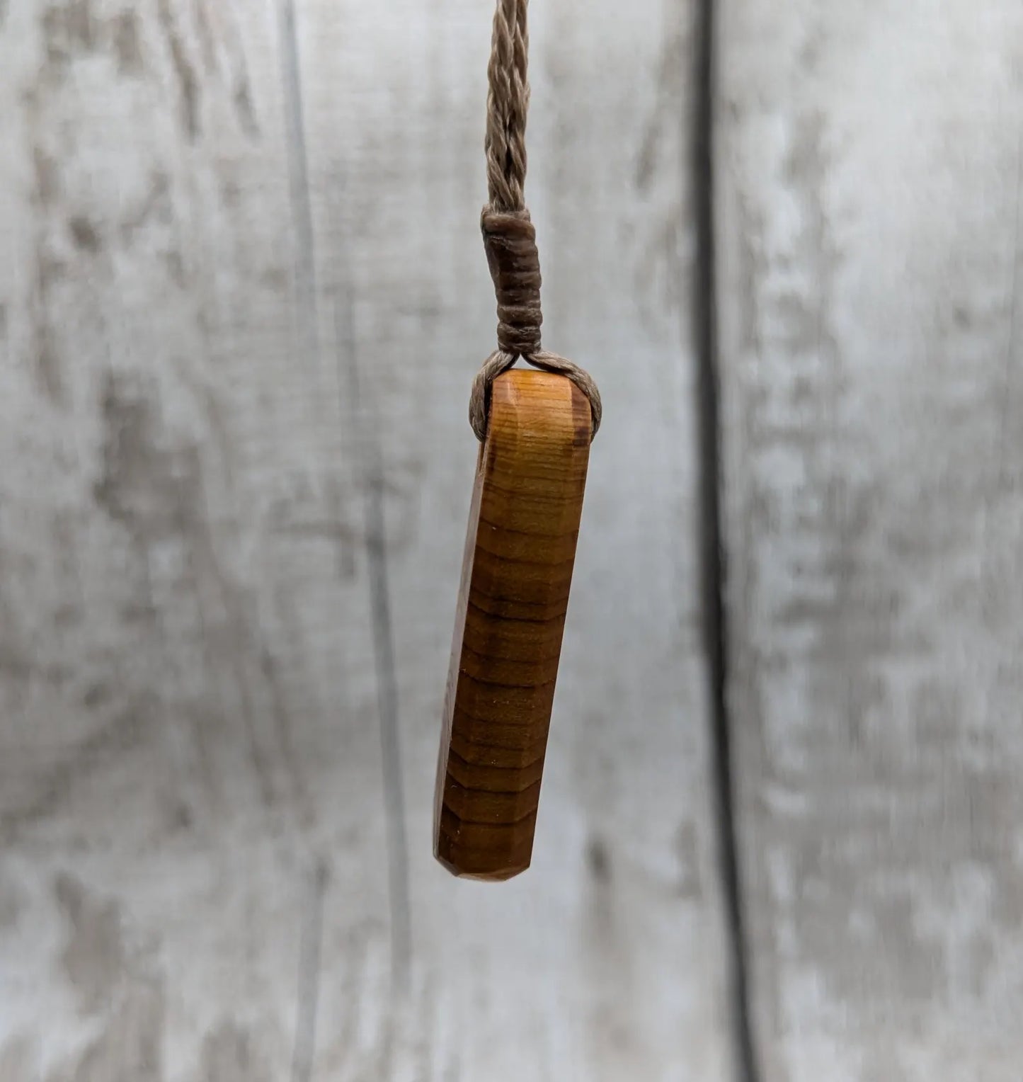 Yew wood roimata tear drop pendant.