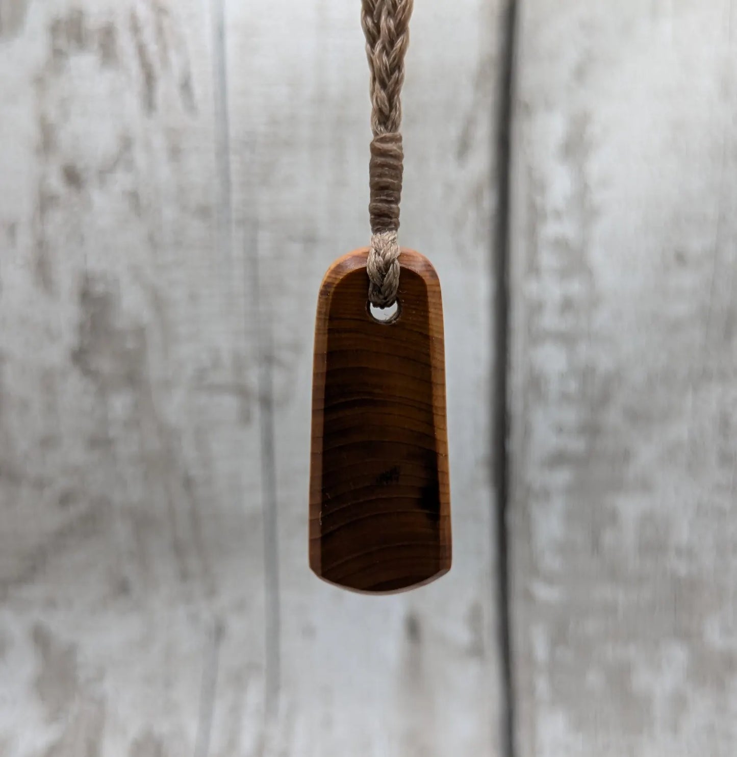 Yew wood roimata tear drop pendant.