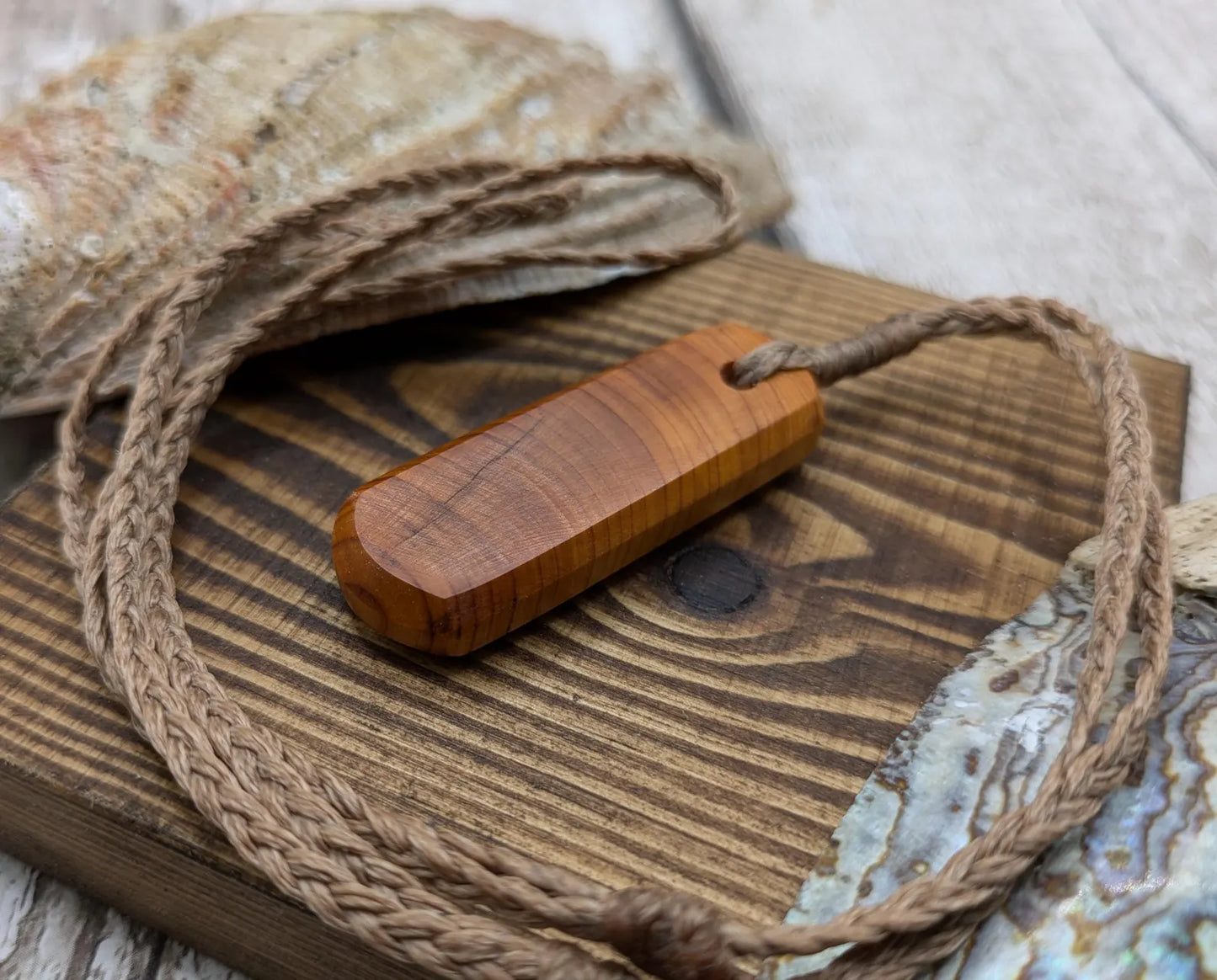 Yew wood roimata drop pendant.