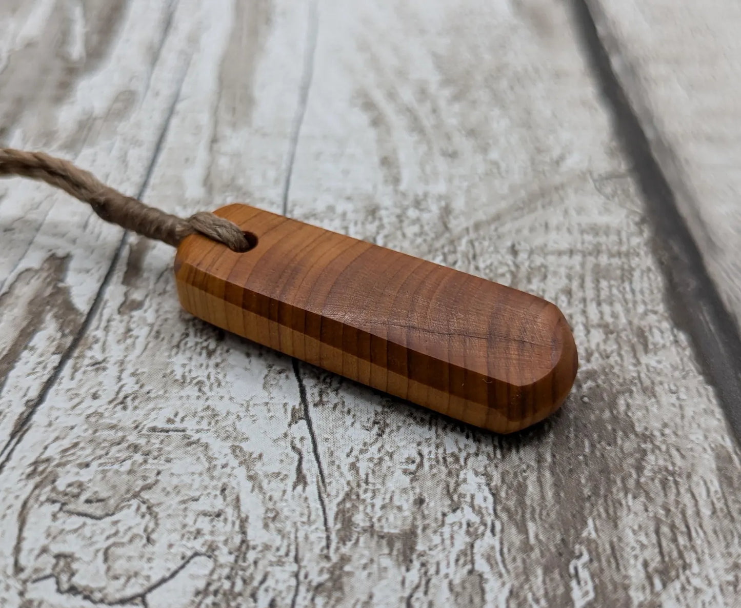 Yew wood roimata drop pendant.