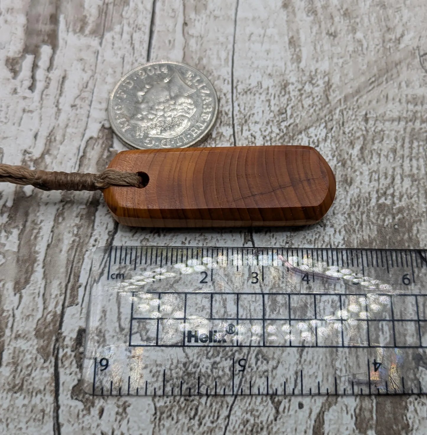 Yew wood roimata drop pendant.